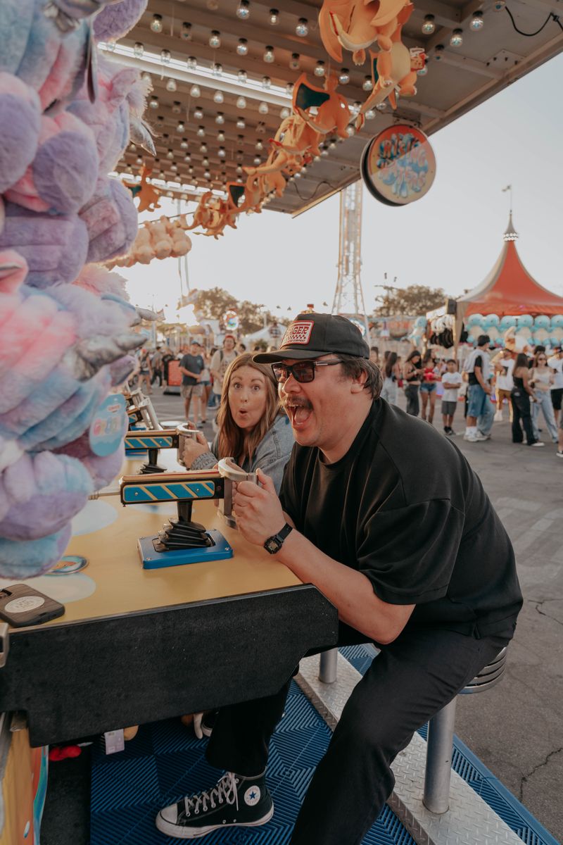 Ryan and Rachel sharing cotton candy and laughing