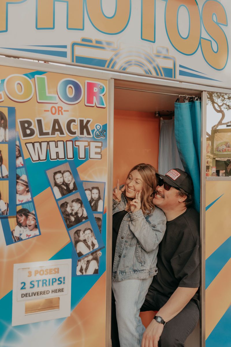 Ryan and Rachel by the fair photo booth