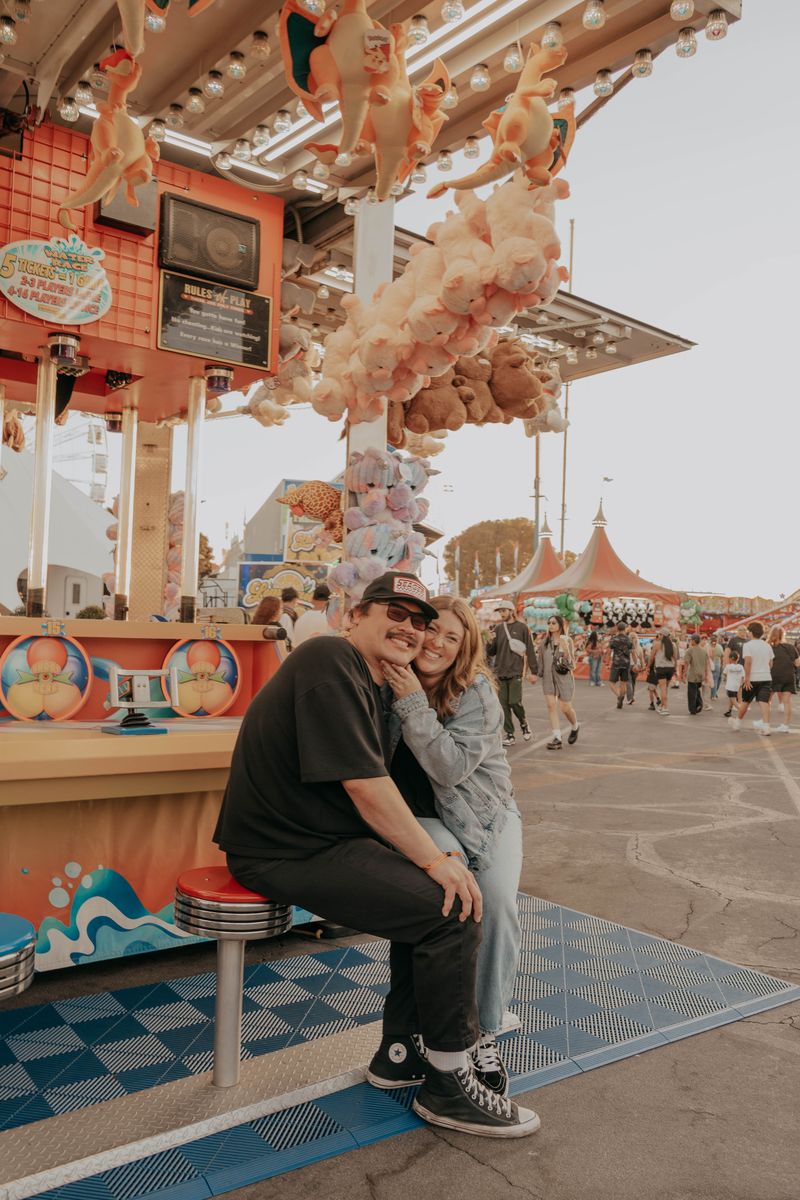 Ryan and Rachel by a carousel