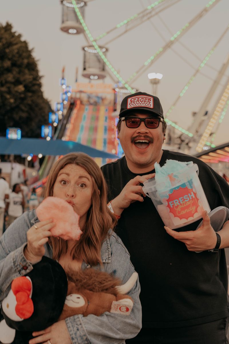 Ryan and Rachel sharing cotton candy on the midway